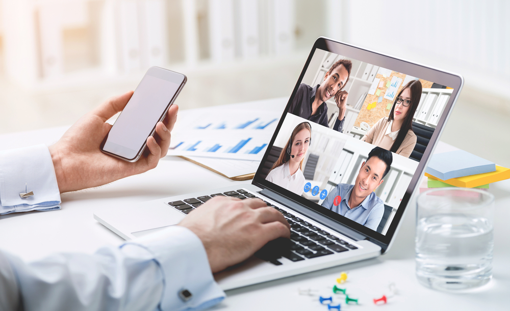Five people having a video conference in a stock photo